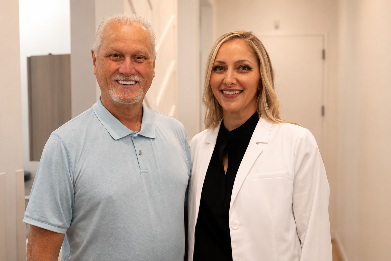 dentist and patent standing together and smiling